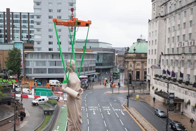 Statues being installed at The Majestic in Leeds
