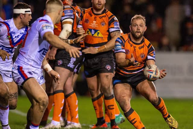 Castleford Tigers' Paul McShane clears the ball from a scrum during this season's derby against Wakefield Trinity. Picture by Bruce Rollinson.