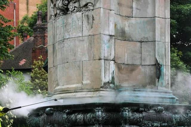 A council worker cleaning the Queen Victoria statue in Woodhouse Moor earlier this week.