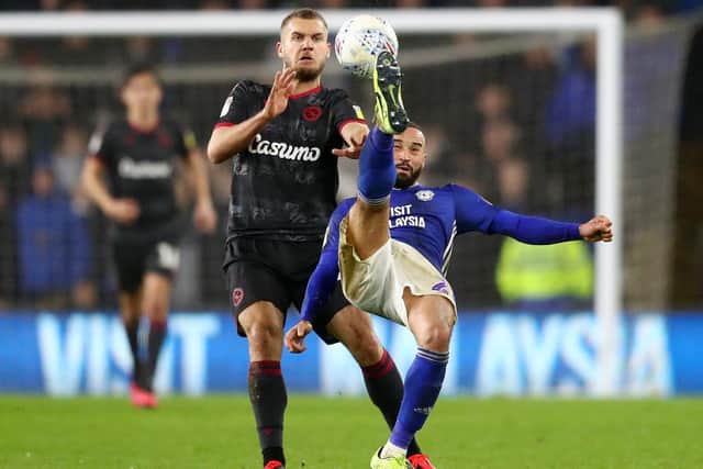 STRUGGLING: Cardiff City's Wales international full-back Jazz Richards, right, pictured clearing the ball under pressure from Reading's George Puscas in January. Photo by Michael Steele/Getty Images.