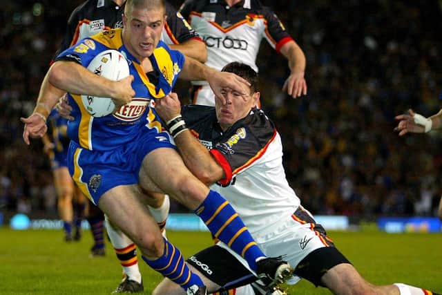Leeds Rhinos' Matt Diskin bulldozes his way past Bradford Bulls's Michael Withers to score his team's opening try during the 2004 Grand Final. Picture: Gareth Copley/PA.