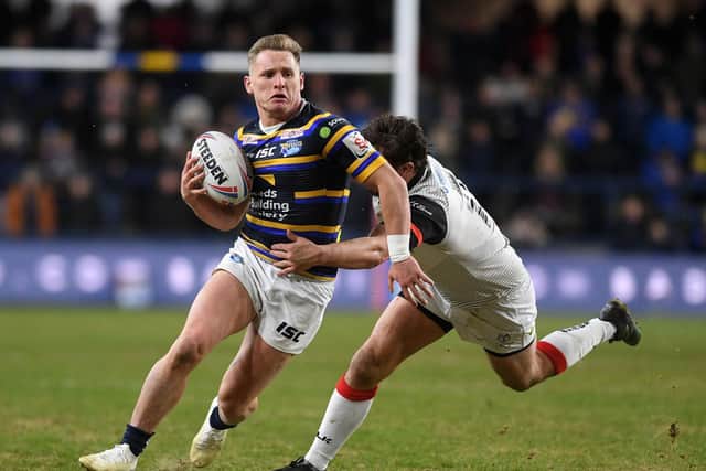 Brad Dwyer breaks a tackle for Leeds against Toronto. Picture by Jonathan Gawthorpe.