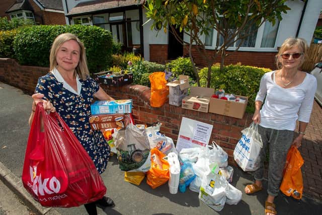 Community foodbank network in Weetwood, where residents have hosted food donation points. Pictured organiser Emma Flint with Alison Larkin, a resident who volunteered. Picture Bruce Rollinson