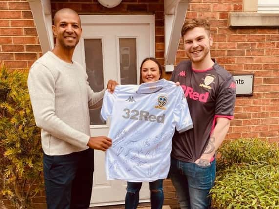 WINNERS - Whites hero Jermaine Beckford presenting Harry and Chelsey with the signed Leeds United shirt this morning