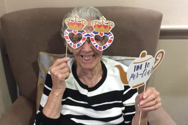Cookridge Court Care Home resident Jean Corcoran joins in the celebrations for the Queen's birthday party.