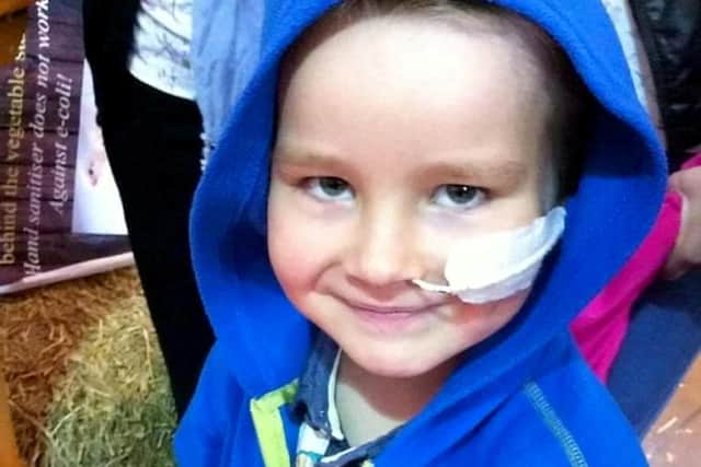 A young boy with cancer was left heartbroken after a callous fraudster stole hundreds of pounds he had saved up to buy his dream dog. Photos: SWNS