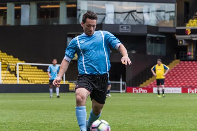DREAM - Seb Wassell, pictured in an SI Games football match, plays Football Manager and watches Leeds United for a living.