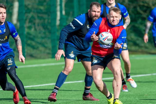 HELPING HAND: Leeds Rhinos' players are spurring each other on remotely as they keep in shape ahead of a return to full training, which they haven't done since March, above.
 Picture: Bruce Rollinson
