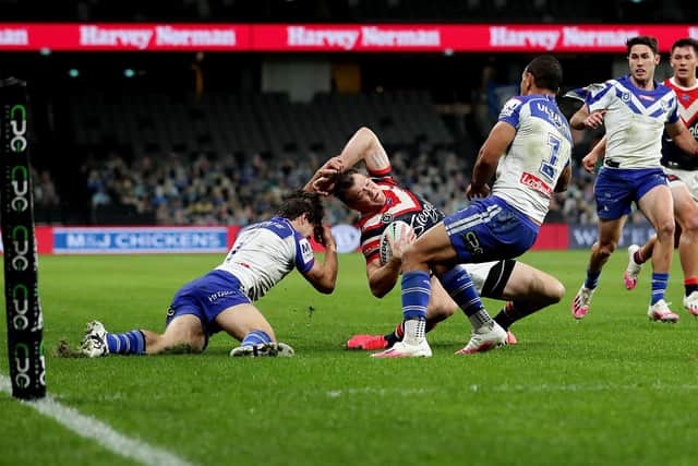 Sydney Roosters' Josh Morris Is tackled by Lachlan Lewis of Canterbury Bulldogs in NRL round five. Picture by Mark Metcalfe Getty Images