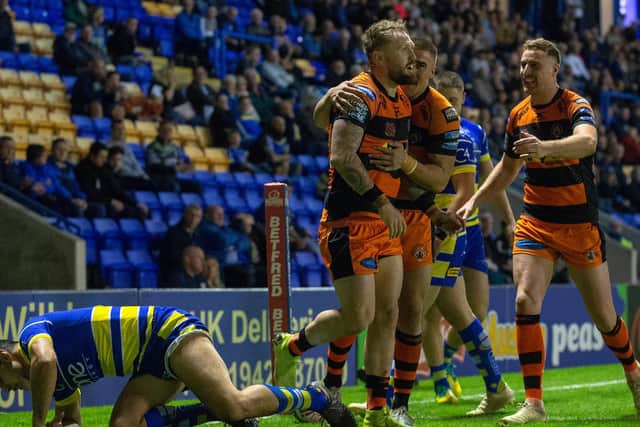 Tigers celebrate Rankin's try against Warrington in last year's play-offs. Picture by Bruce Rollinson.