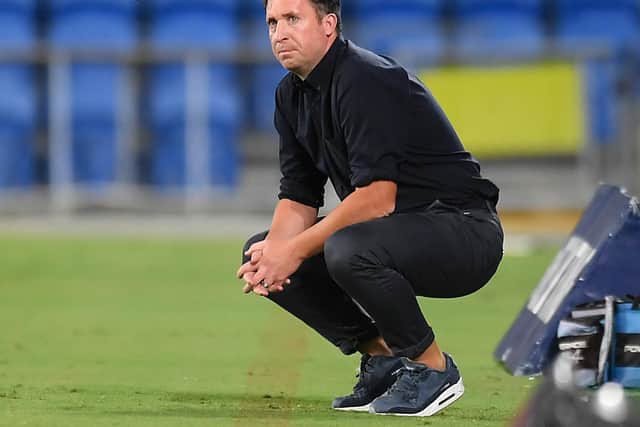 STUCK: Former Leeds United striker and now Brisbane Roar boss Robbie Fowler, pictured watching on during the clash against Newcastle Jets at Cbus Super Stadium on March 20. Photo by Albert Perez/Getty Images.