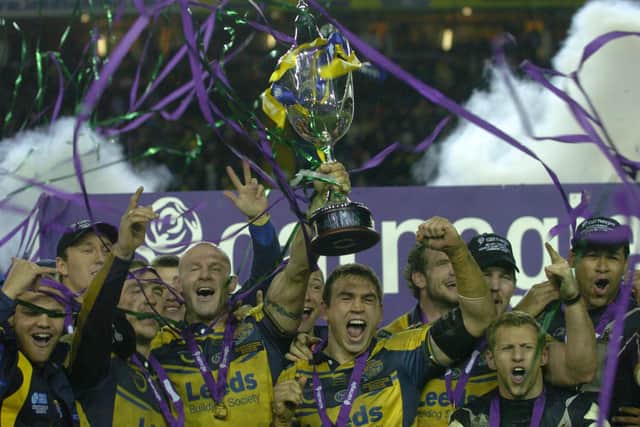 Rhinos celebrate with the trophy. Picture by Steve Riding.
