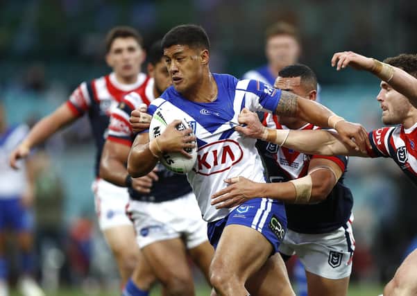 SYDNEY, AUSTRALIA - JUNE 16: Fa'amanu Brown of the Bulldogs is tackled during the round 14 NRL match between the Sydney Roosters and the Canterbury Bulldogs at the Sydney Cricket Ground on June 16, 2019 in Sydney, Australia. (Photo by Ryan Pierse/Getty Images)