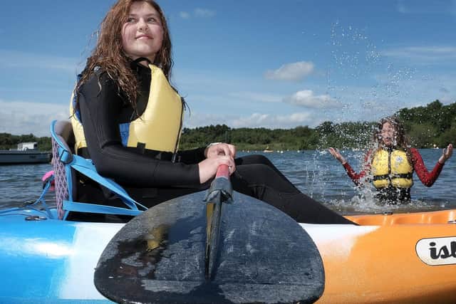 Kayaking are Maddy Elder and Alex Beeson