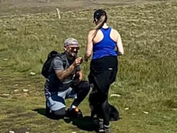 Michael Almond inadvertently captured this couple's proposal while taking a photograph in the Yorkshire Dales. He is now trying to find them so he can give them the photograph.