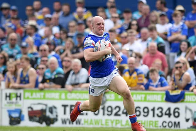Lee Kershaw races away to score on his Trinity debut against Leeds last year. Picture by Jonathan Gawthorpe.