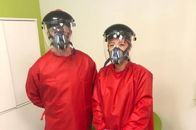 Farsley Dental Practice's Dr Jon Swarbrigg and dental nurses Motoko Gumbs in full PPE kit.