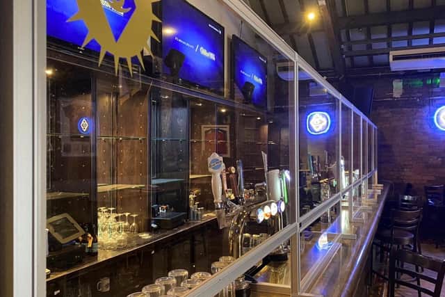 Protective screens have been installed at Brotherhood's bars as it prepares to reopen