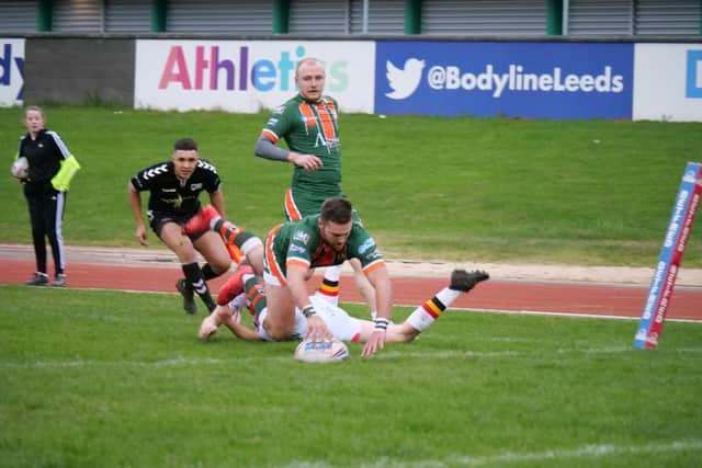 It is still not known if or when League One Hunslet - whose AJ Boardman is pictured scoring in pre-season against Bradford Bulls - will play again. Picture by Paul Johnson.