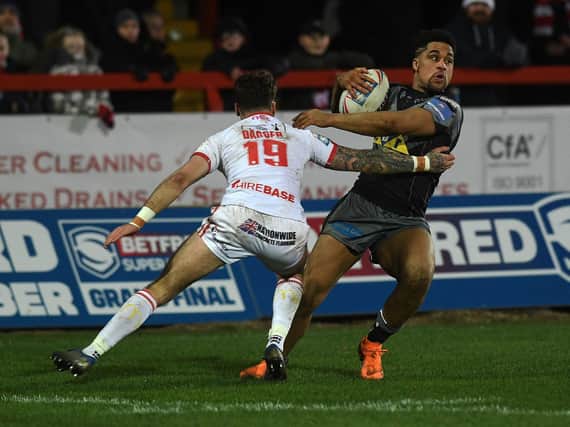 Darrell Olpherts tries to shake off Hull KR's Will Dagger. Picture by Jonathan Gawthorpe.