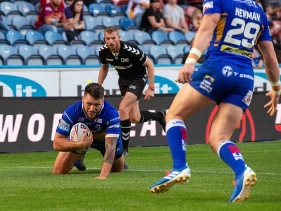 Tom Briscoe scores away to Huddersfield Giants on August 2 last year, the game in which he suffered a season-ending knee injury. Picture by Bruce Rollinson.