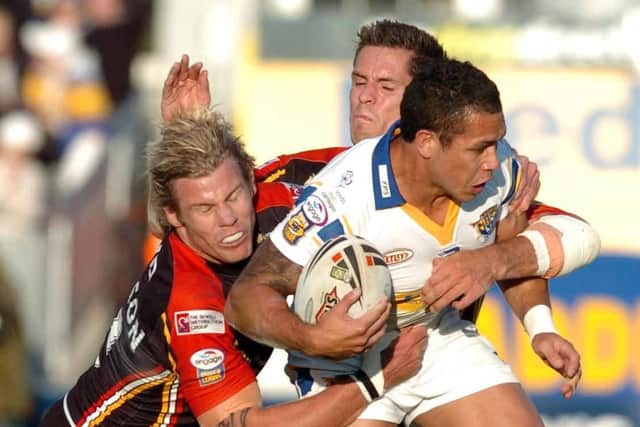 Brent Webb is tackled by the Bradford Bulls defence on this day in 2007. Picture: Tony Johnson.