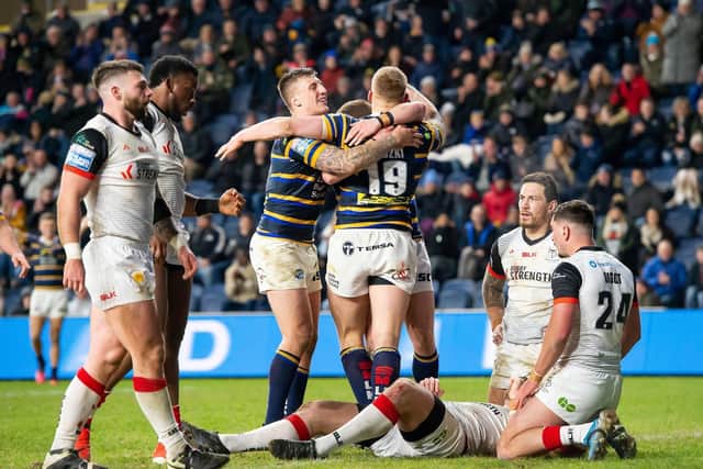Leeds Rhinos' Mikolaj Oledzki is congratulated by Callum McLelland on his try against Toronto Wolfpack. Picture: SWPix.com.