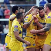 Liam Sutcliffe is congratulated after kicking a last-minute penalty to earn Leeds Rhinos a 32-31 victory over Catalans Dragons in 2014. Picture: Steve Riding.