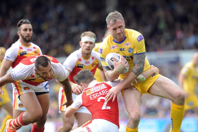 Jamie Peacock takes on Catalans Dragons' Morgan Escare. Picture: Steve Riding.