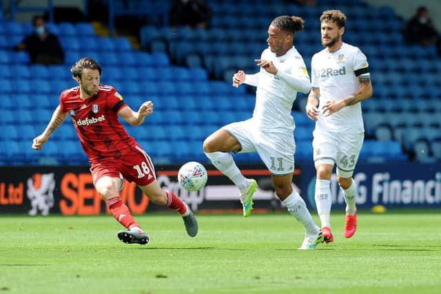 DUAL ROLE: For Leeds United's Wales international Tyler Roberts, centre, pictured being challenged by Fulham's Harry Arter, left. Photo by Simon Hulme.