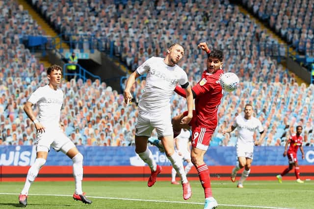 BATTLE: Leeds United defender Luke Ayling clears under pressure from Fulham striker Aleksandar Mitrovic. Picture by Martin Rickett/PA Wire.