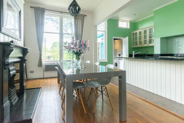 The kitchen dining room with original fireplace