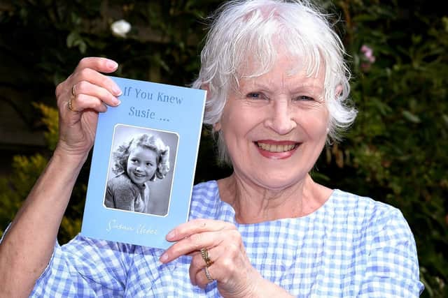 Sue Herdman with a copy of If You Knew Susie