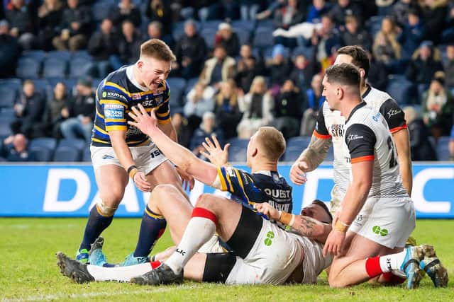 Picture by Allan McKenzie/SWpix.com - 05/03/2020 - Rugby League - Betfred Super League - Leeds Rhinos v Toronto Wolfpack - Emerald Headingley Stadium, Leeds, England - Leeds's Mikolaj Oledzki is congratulated by Callum McLelland on his try against Toronto.