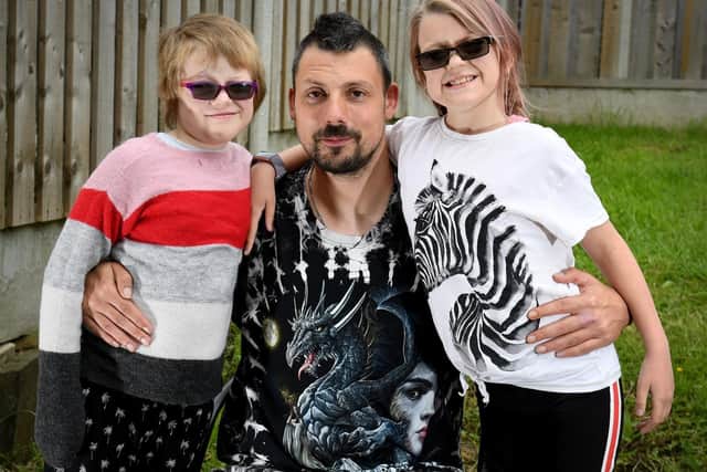 Darren Atkinson pictured with his two daughters.
An appeal has been launched to find  a kidney donor for  Emily Atkinson (right).
Mr Atkinson underwent a transplant operation and has donated one of  kidneys to Poppy-Mae (left).
Picure: Simon Hulme