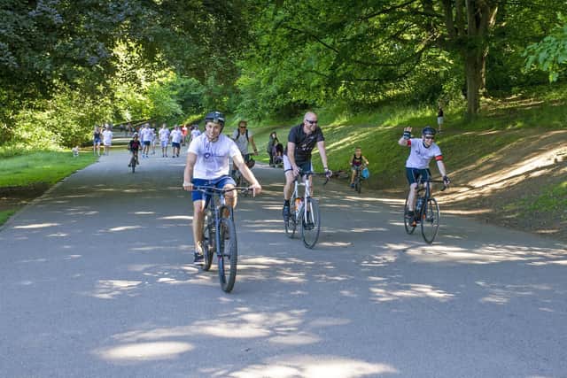 Staff from Tilney's Leeds office have cycled, walked and ran over 7,500 miles in aid of the Children's Heart Surgery. They rode into Roundhay Park for the grand finale. Picture: Tony Johnson