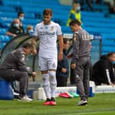 WORRY - Liam Cooper limping off in the 12th minute in Leeds United's game at home to Luton Town. Pic: Bruce Rollinson