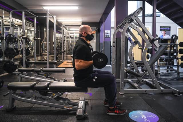 Operations manager Graham Lilley trains with a pair of dumbbells at the Anytime Fitness gym centre in Leeds (photo: SWNS).