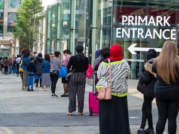 Shoppers queue for Primark after non-essential retailers were allowed to reopen. Photo: Bruce Rollinson