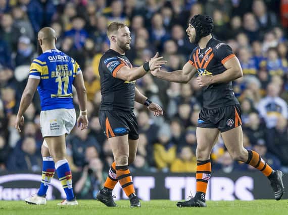 Paul McShane, left, congratulates Luke Gale following his drop goal for Tigers against Rhinos at Elland Road in 2018. Picture by Allan McKenzie/SWpix.com