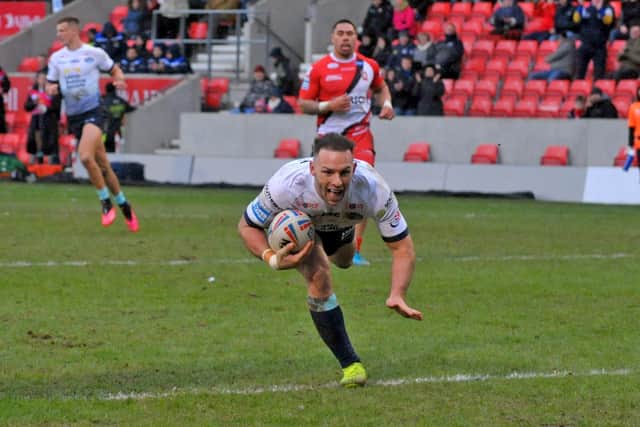 Luke Gale scores for Rhinos in this season's win at Salford. Picture by Steve Riding.