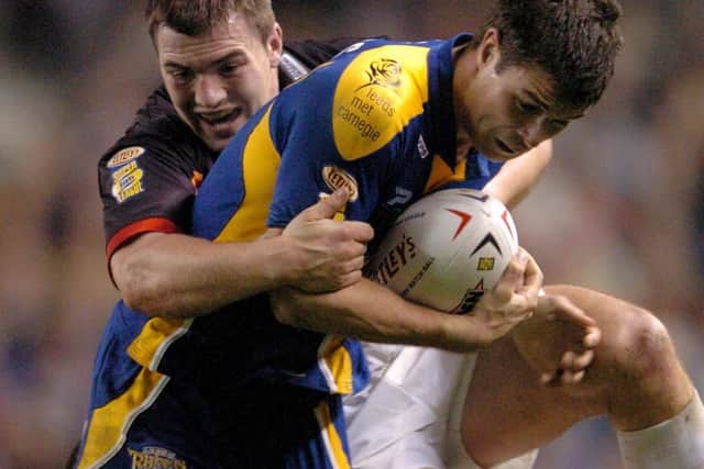 Richie Mathers is tackled by Iestyn Harris at Old Trafford in 2004. Picture by Steve Riding.