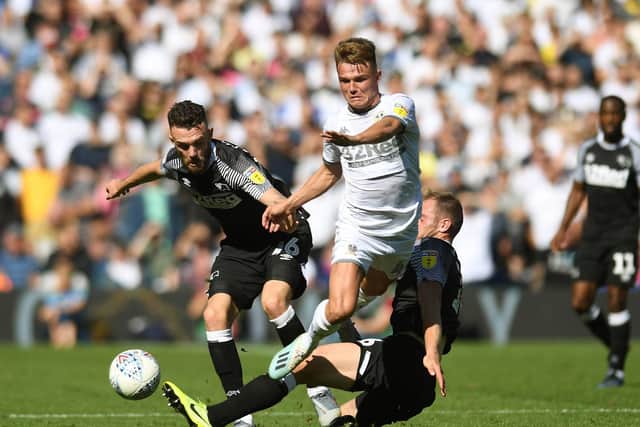 HURT: Jamie Shackleton, above, says Leeds United will ultimately be even better off following the pain felt in last season's play-offs semi-final second leg at home to Derby County, pictured. Photo by Jonathan Gawthorpe.