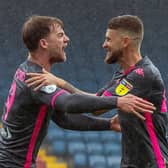 Patrick Bamford celebrates his opening goal at Blackburn with Mateusz Klich. Picture: Bruce Rollinson.