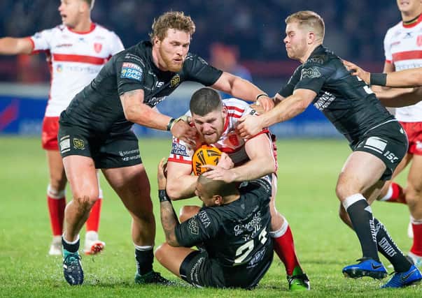 Picture by Allan McKenzie/SWpix.com - 01/02/2019 - Rugby League - Betfred Super League - Hull KR v Hull FC - KC Lightstream Stadium, Hull, England - Mitch Garbutt is tackled by Scott Taylor, Sika Manu & Danny Washbrook.
