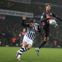 'BIG TWO': West Brom's Conor Townsend, left, and Leeds United striker Patrick Bamford lock horns in the New Year's Day clash at The Hawthorns. Photo by Mike Egerton/PA Wire.