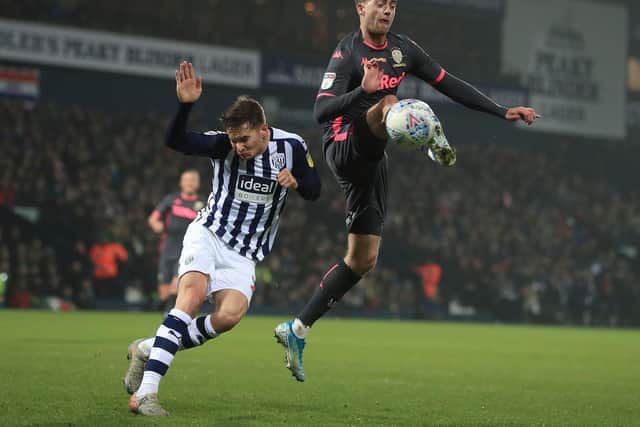 'BIG TWO': West Brom's Conor Townsend, left, and Leeds United striker Patrick Bamford lock horns in the New Year's Day clash at The Hawthorns. Photo by Mike Egerton/PA Wire.