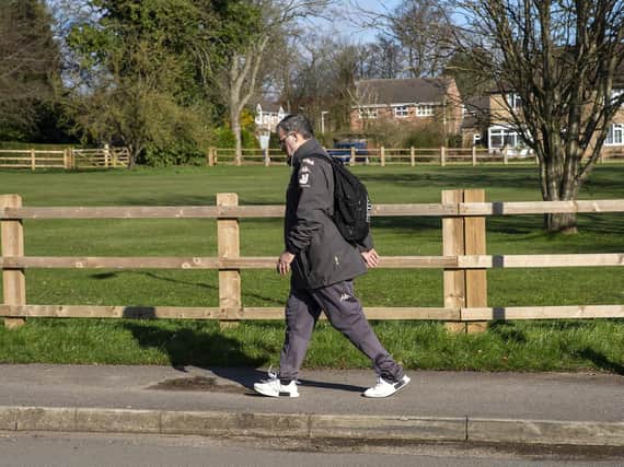 THE OFFICE - Leeds United head coach Marcelo Bielsa on his way into work, where his standards have helped the Thorp Arch academy achieve Category One status. Pic: PA