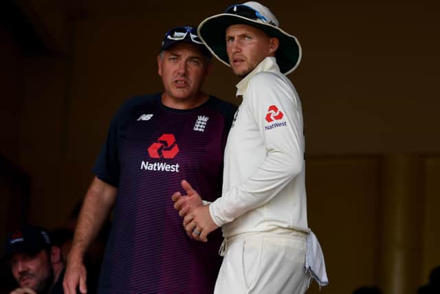 MISSING IN ACTION: England captain Joe Root speaks with coach Chris Silverwood in Sri Lanka earlier this year. Picture: Gareth Copley/Getty Images.