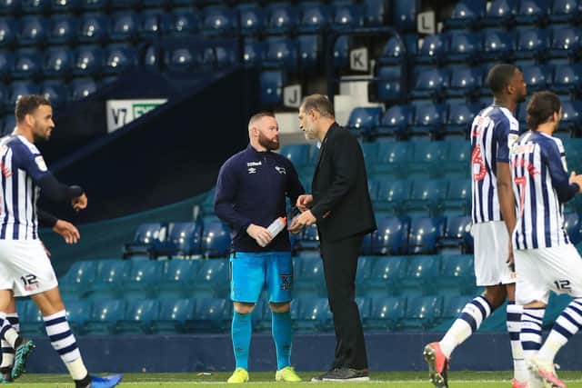 DEBRIEF: West Brom boss Slaven Bilic chats to Derby County captain Wayne Rooney after Wednesday evening's 2-0 success for the Baggies at The Hawthorns. Picture by Mike Egerton/PA Wire.